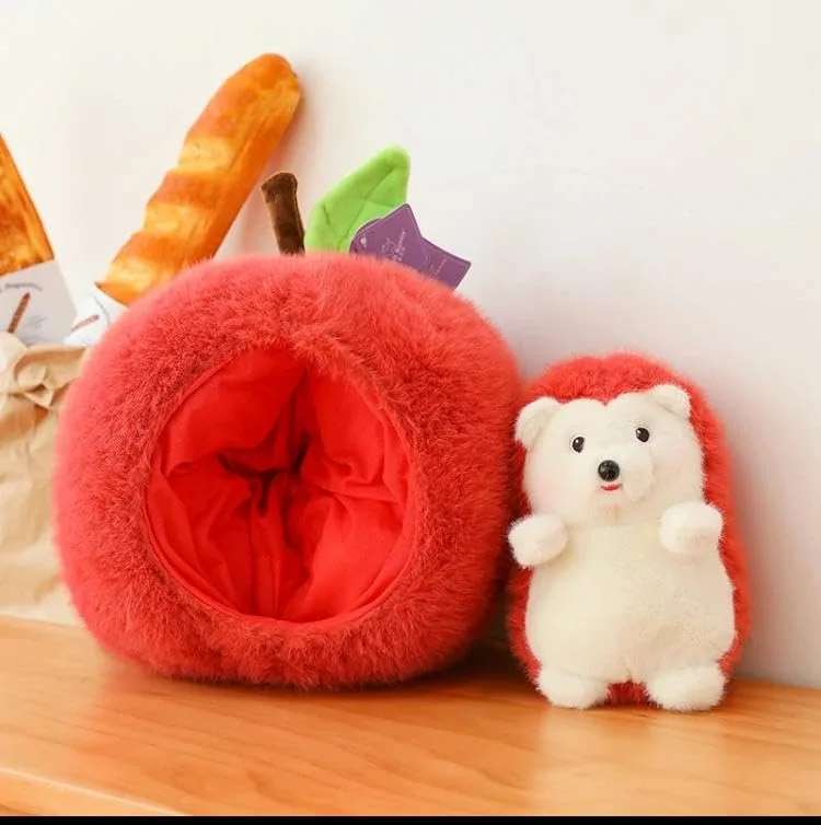 Open Apple Hedgehog Plush Pillow with the hedgehog plush toy placed outside, next to a baguette on a wooden surface