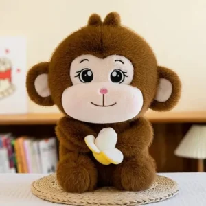Dark brown Monkey Soft Toy holding a banana on a table mat
