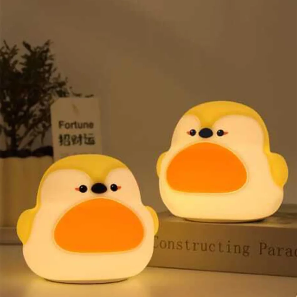"Two Robin Bird Lamps on a shelf emitting warm LED light"