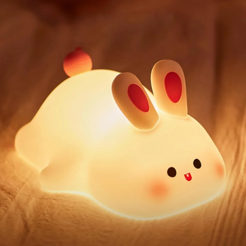 Glowing bunny-shaped silicone Rabbit Lamp on a bed
