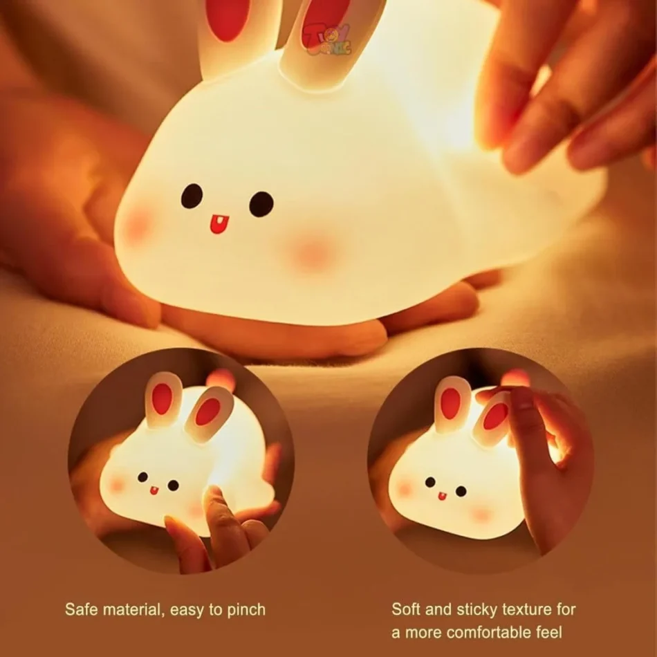 Hands squeezing the soft silicone Rabbit Lamp