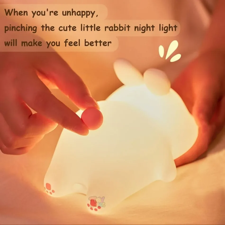 Person pinching the soft tail of the Rabbit Lamp